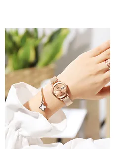 Elegant rose gold quartz watch for women featuring double calendar and mesh steel strap