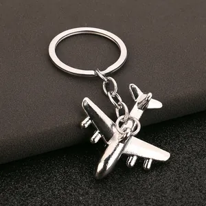 Creative zinc alloy airplane keychain featuring a shiny silver metallic finish for men