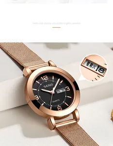 Close-up of rose gold quartz watch featuring a black dial and dual date display
