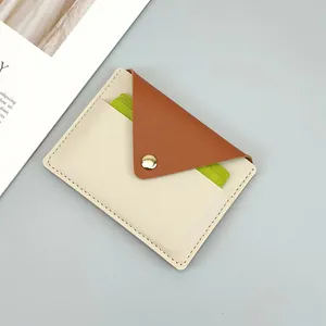 Close-up of slim leather card holder for women with stylish two-tone color block design