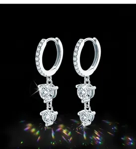 Detailed view of sterling silver moissanite drop earrings with brilliant 3EX cut stones