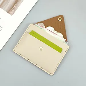 Slim minimalist women's beige leather card holder and coin purse with snap button closure