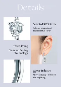 Detail view of moissanite earrings showing the three-prong silver setting and craftsmanship.