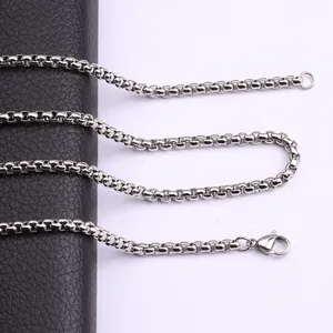 Detailed macro view of a durable silver titanium steel box chain with lobster clasp