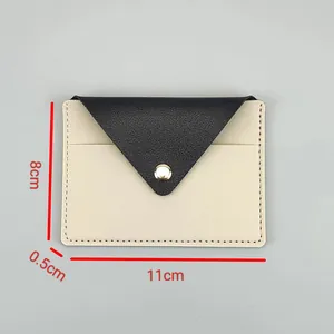 Detailed view showing the precise dimensions of this slim cream and black lady card holder.