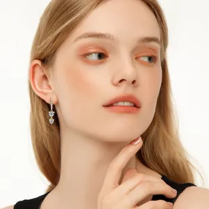 Elegant 925 sterling silver long tassel moissanite earrings on a model in close-up