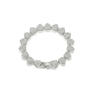 Close-up of elegant silver-tone bracelet featuring pavé-set rhinestone heart links