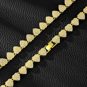 Detailed view of gold-plated iced-out heart chain necklace featuring pave rhinestones