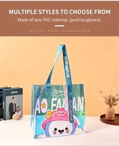 Close-up of a large iridescent PVC tote bag featuring a cute cartoon character and blue straps.