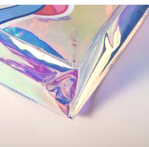 Close-up detail of iridescent holographic PVC tote bag showing stitching and texture
