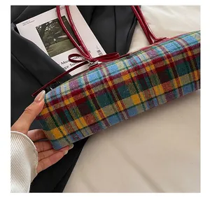 Close-up showing the precise stitching details of a vintage plaid pattern Boston handbag for women