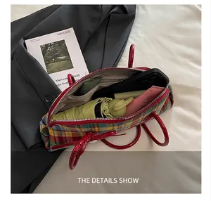 Detail view of plaid Boston bag interior showing large capacity for essentials