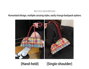 Detail view showing hand-carry and shoulder-carry styles of the plaid Boston bag