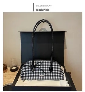 Detailed view of vintage black and white gingham Boston bag in elegant gift box