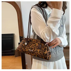 Stylish leopard print Boston underarm bag paired with a casual sweater vest outfit
