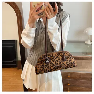 Elegant vintage leopard print Boston shoulder bag styled with an autumn outfit for women