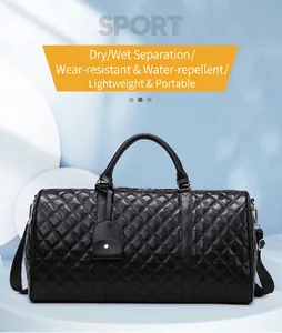 Detail view of premium black quilted travel duffel bag with dry wet separation features
