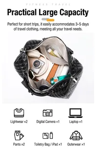 Macro view of interior storage space of black quilted travel duffel bag showing capacity