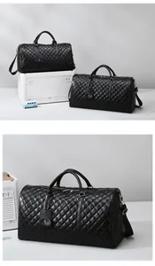 Detailed view of black quilted travel duffel bags in two sizes for luggage storage