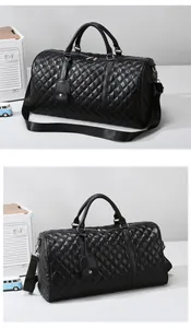 Black quilted faux leather travel duffel bag featuring shoulder strap and top handles