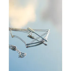 Taylor Swift inspired silver bow and arrow pendant necklace, elegant jewelry gift