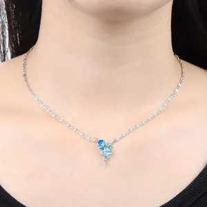 Elegant star and moon sun necklace with blue crystals on a silver chain for women