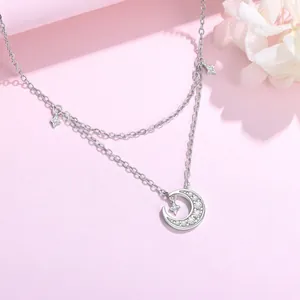 Silver double-layer necklace with sparkling zirconia crescent moon and star pendant