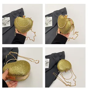 Detailed views of a gold heart-shaped evening clutch with glitter and chain strap