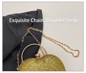 Close-up of gold glitter heart-shaped evening bag with delicate chain strap