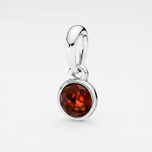 Polished silver-plated round pendant charm with faceted deep red garnet-style birthstone