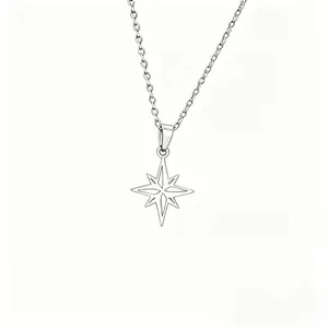 Close-up detail of a minimalist silver titanium steel eight-pointed star pendant necklace.