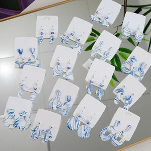 Collection of various blue and white porcelain earrings featuring elegant 925 silver posts
