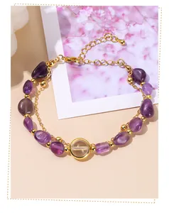 Detailed view of natural amethyst tumbled beads and gold chain double-layer bracelet