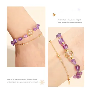 Close-up view of natural amethyst bead bracelet with double-layer gold chain.