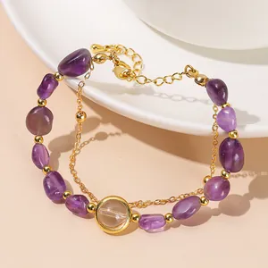 Natural amethyst chip double-layer bracelet with gold-tone chain and crystal charms.