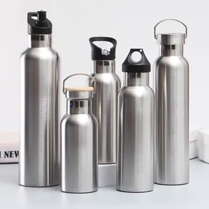 A collection of various sized stainless steel vacuum flasks for outdoor sports and travel