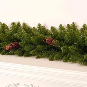 Close-up of lush artificial pine garland with realistic pine cones and LED lights.