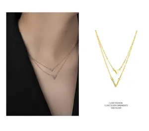 Detailed close-up view of S925 sterling silver V-shaped and triangle double-layer necklace