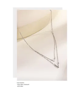 Close-up of S925 silver double-layer necklace with V and triangle pendants