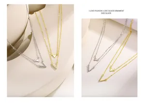 Close-up of S925 silver double-layered necklace with V and triangle charms