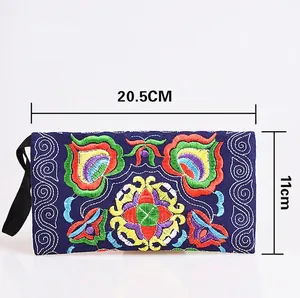 Ethnic style embroidered canvas clutch with colorful floral patterns and size markings