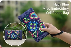 Detailed view of the Yunnan ethnic style floral embroidered canvas clutch handbag