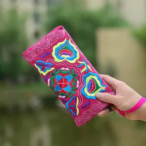 Handmade Yunnan ethnic floral embroidered canvas long wallet clutch in vibrant pink