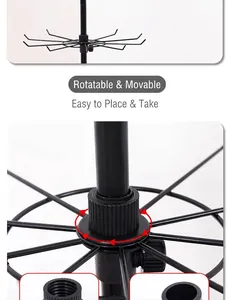 Close-up detail of rotating mechanism on a black metal multi-tier display stand