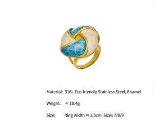Detailed view of gold-tone ring featuring blue and white marbled enamel flower design