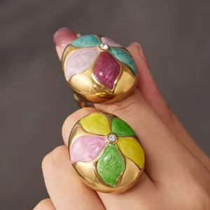 Vintage gold stainless steel ring featuring colorful enamel petals and a central zircon.