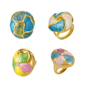 Vintage stainless steel rings with colorful enamel floral designs and zircon accents
