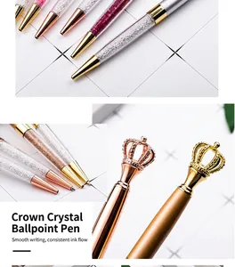 Close-up detail of elegant metal crown pens with sparkling crystal fillings