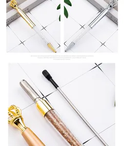 Detailed view of elegant metal crown crystal ballpoint pens with replacement ink refills