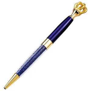 Elegant metal ballpoint pen featuring a gold crown top and blue crystal-filled barrel.